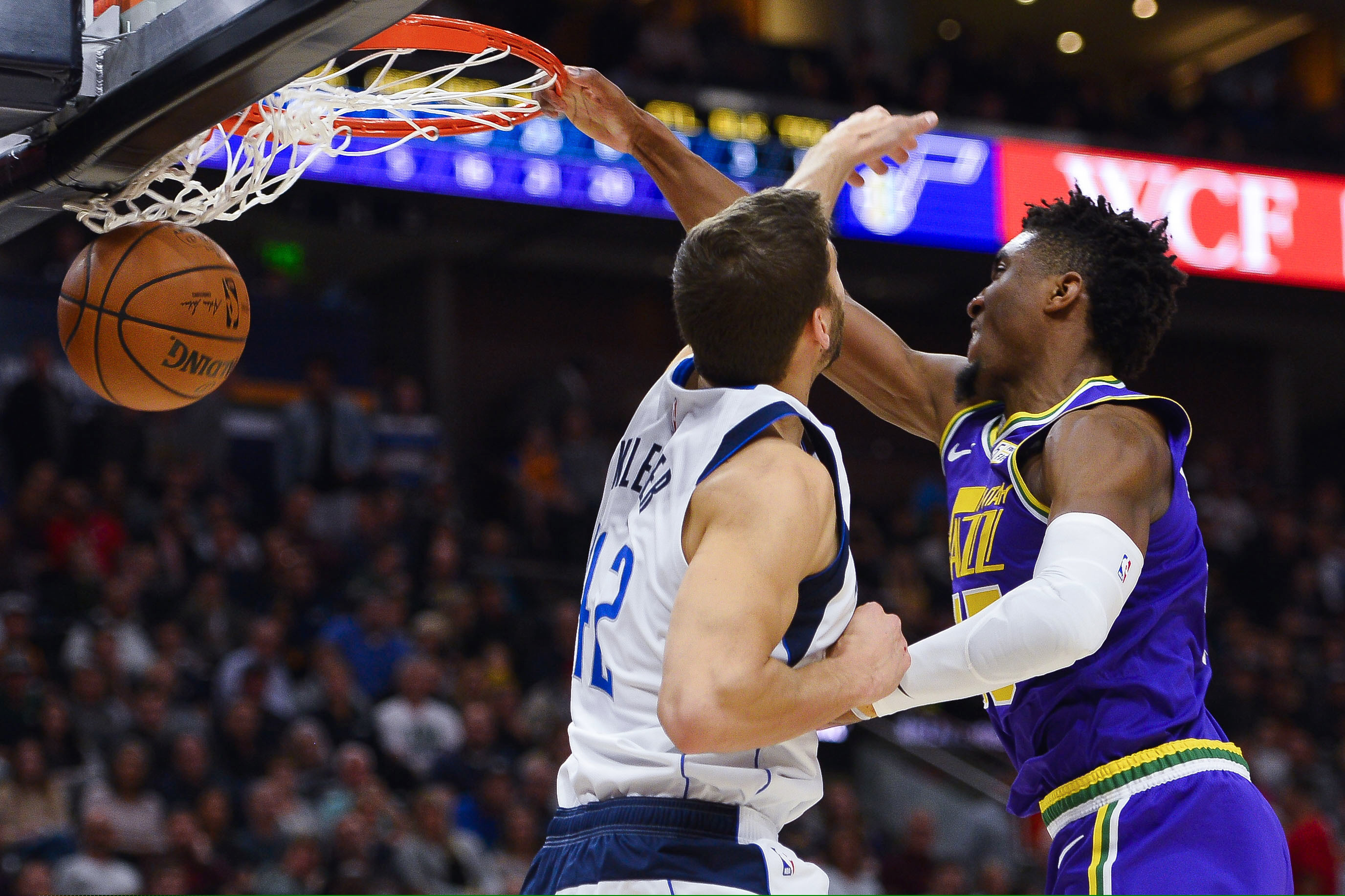Utah Jazz guard Donovan Mitchell (45) dunks over Dallas Mavericks forward Maximilian Kleber (42) during the first half of an NBA basketball game Wednesday, Nov. 7, 2018, in Salt Lake City. (AP Photo/Alex Goodlett)