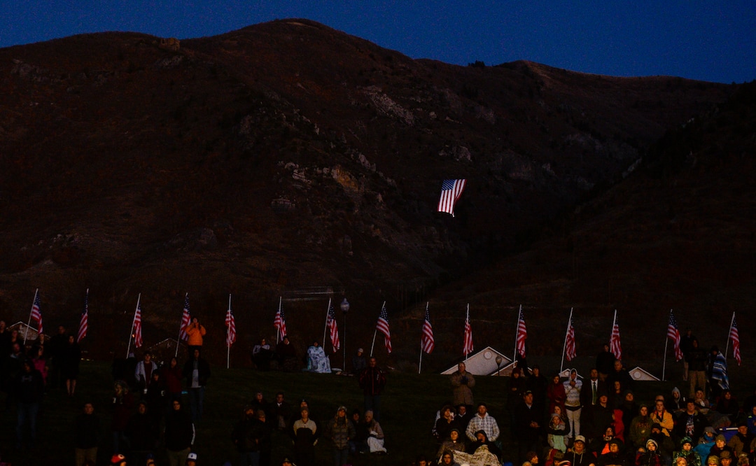 Leah Hogsten  |  The Salt Lake Tribune  A gigantic American flag named "Betsy" flies above North Ogden during the Veteran's Day ceremony. Veterans, family members of active and retired military and patriotic supporters celebrated Veteran's Day at the Barker Park amphitheater in North Ogden with a  memorial for North Ogden's hometown hero Army Major Brent Russell Taylor, who was killed in action on November 3, 2018, while training an Afghan Army commando battalion in Afghanistan.