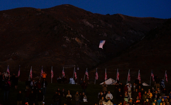 Leah Hogsten  |  The Salt Lake Tribune  A gigantic American flag named "Betsy" flies above North Ogden during the Veteran's Day ceremony. Veterans, family members of active and retired military and patriotic supporters celebrated Veteran's Day at the Barker Park amphitheater in North Ogden with a  memorial for North Ogden's hometown hero Army Major Brent Russell Taylor, who was killed in action on November 3, 2018, while training an Afghan Army commando battalion in Afghanistan.
