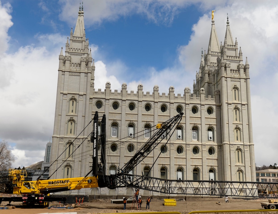 (Leah Hogsten | The Salt Lake Tribune) Crews rig a giant crane on the grounds of The Church of Jesus Christ of Latter-day Saints' Salt Lake Temple, April 2, 2020. The temple, closed in December for seismic upgrades, sustained minor damage during the March 18, 2020, earthquake. The trumpet on the Angel Moroni statue fell off, and there is minor displacement of some of the temple's smaller spire stones.