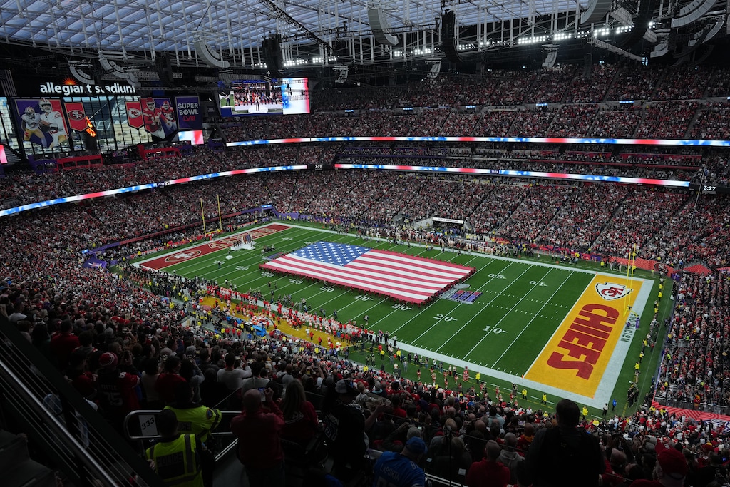 (Doug Mills | The New York Times) An American flag covers the field before the first quarter of Super Bowl LVIII at Allegiant Stadium in Las Vegas in 2024. This Sunday's Super Bowl will feature the Kansas City Chiefs against the Philadelphia Eagles.
