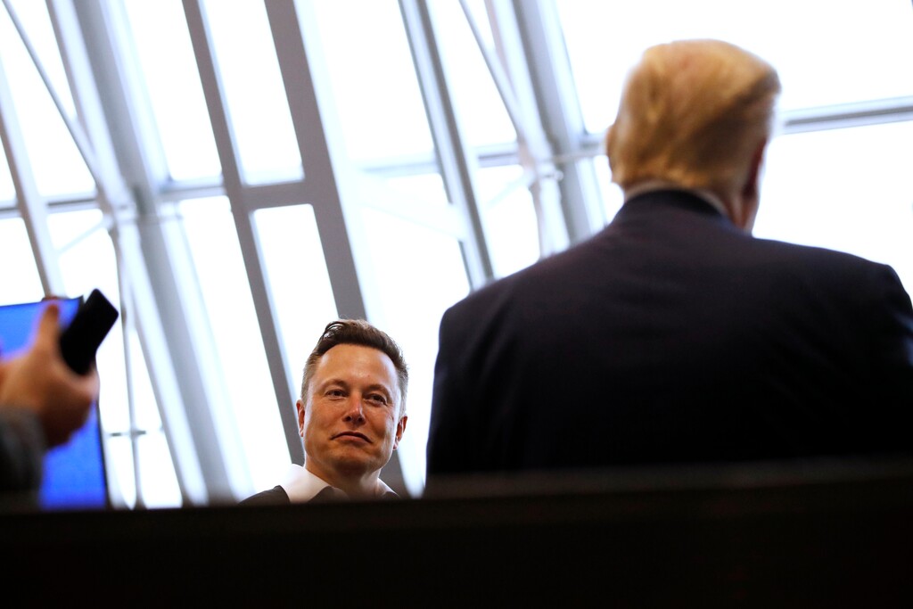 Tesla and SpaceX Chief Executive Officer Elon Musk speaks with President Donald Trump speaks in the SpaceX command center at Kennedy Space Center, Saturday, May 30, 2020, in Cape Canaveral, Fla. (AP Photo/Alex Brandon)