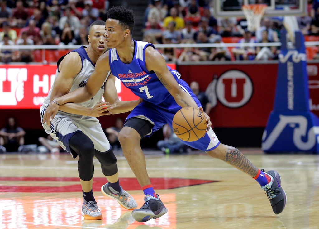 Philadelphia 76ers guard Markelle Fultz (7) drives around Utah Jazz guard Dante Exum during the first half of an NBA summer league basketball game Wednesday, July 5, 2017, in Salt Lake City. (AP Photo/Rick Bowmer)