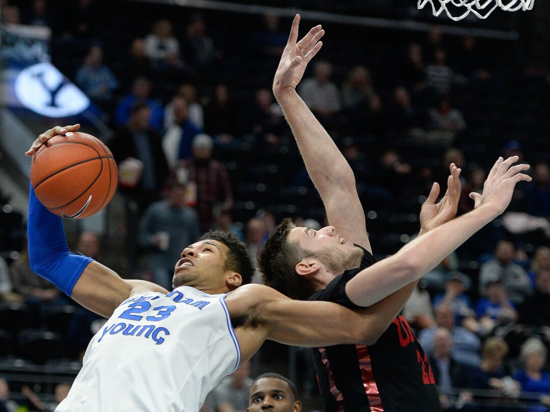 (Francisco Kjolseth  |  The Salt Lake Tribune)  Brigham Young Cougars forward Yoeli Childs (23) gets tangled with UNLV Rebels forward Vitaliy Shibel (22) as BYU takes on UNLV in men's NCAA basketball at Vivint Smart Home Arena in Salt Lake City on Sat. Dec. 7, 2019.