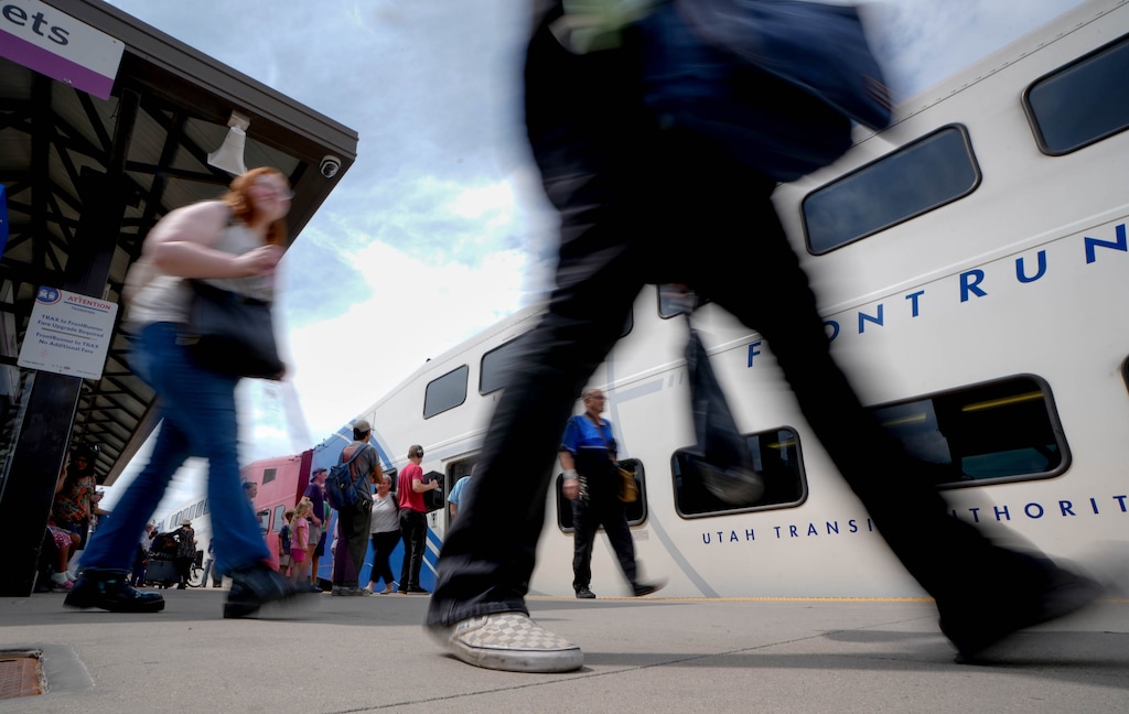 (Francisco Kjolseth | The Salt Lake Tribune) People load and unload from FrontRunner as people use the UTA transit system at North Temple in Salt Lake City on Wednesday, Aug. 12, 2026. UTA is planning to increase fares from $2.50 to $3.