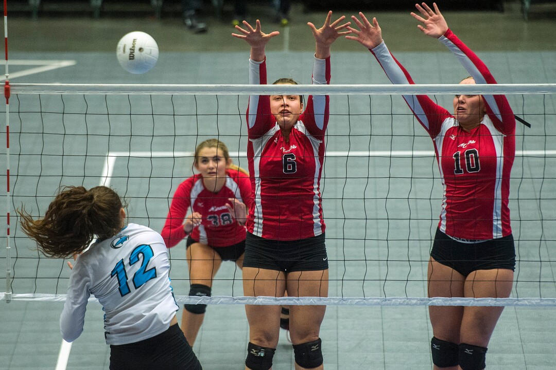 (Chris Detrick  |  The Salt Lake Tribune)  Sky View's Dawson Day (12) spikes past Park City's Emily Smith (6) and Park City's Bella Buchanan (10) during the the 4A volleyball state championships at the UCCU Center at Utah Valley University Thursday, October 26, 2017.  