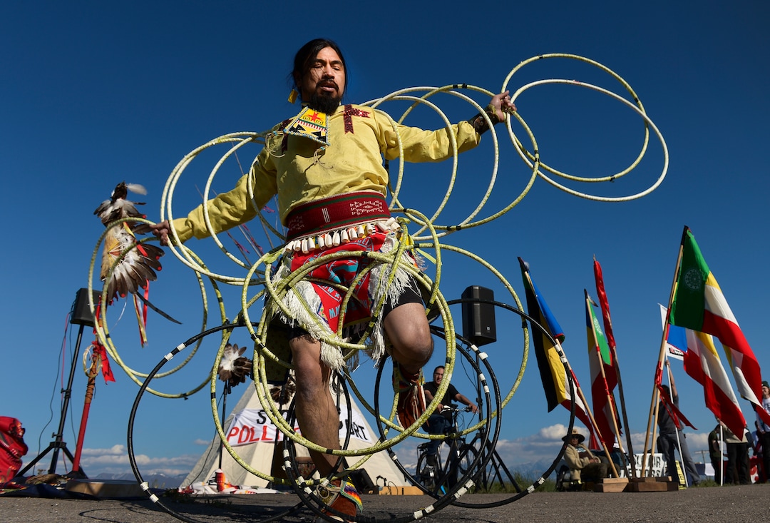 Leah Hogsten  |  The Salt Lake Tribune  Carl Moore, a Hopi and Chemehuevi Native American performs a hoop dance in honor of Mother Earth. Moore also made offerings, sang and gave a prayer during the May Day celebration. The "Stop the Polluting Port" community coalition staged a May Day celebration, calling for respect and awareness of the water, earth and air regarding the 20,000 acres west of Salt Lake City where the inland port industrial site has been proposed.