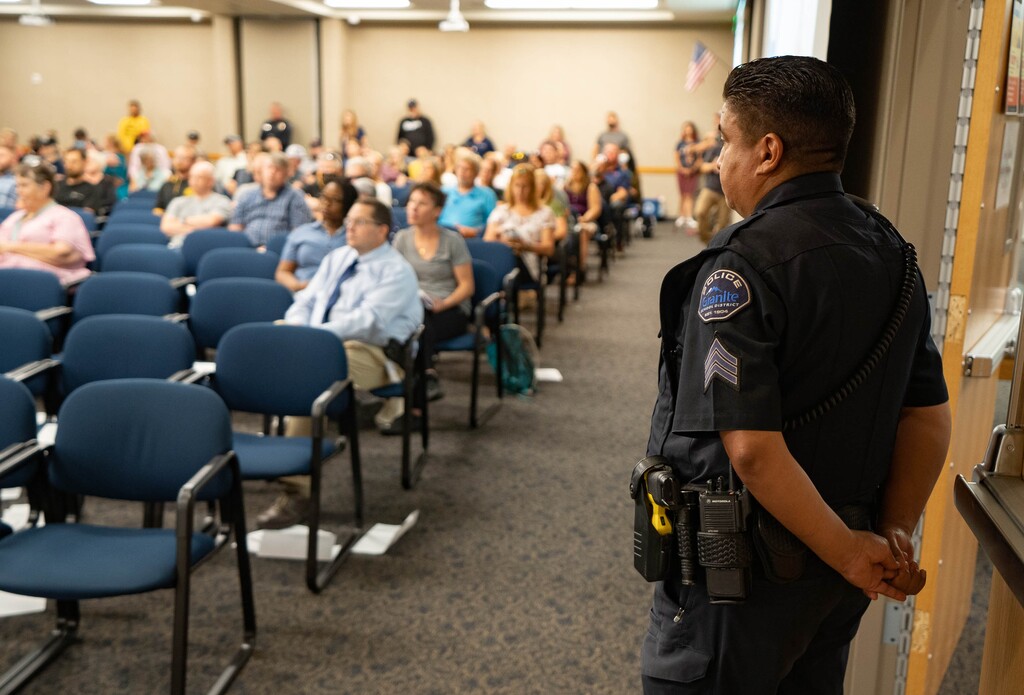 (Francisco Kjolseth | The Salt Lake Tribune) Police keep a watchful eye as protesters swarm the Granite School Board on Tuesday, July 6, 2021, opposing the teaching of critical race theory in schools, alongside those that support it, despite that it’s currently not being taught anywhere in Utah. A state audit released on Monday, Oct. 17, 2022, confirmed there is no widespread teaching of the theory in the state's public K-12 schools.