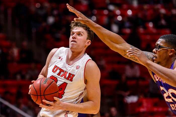 (Trent Nelson | The Salt Lake Tribune)  Utah Utes forward Jayce Johnson (34) defended by Northwestern State Demons forward Ishmael Lane (20) as the University of Utah hosts Northwestern State, NCAA basketball in Salt Lake City, Wednesday December 20, 2017.