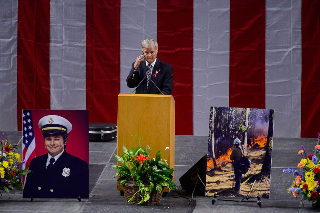 (Trent Nelson | The Salt Lake Tribune)  Speaking at his son Matthew Burchett's funeral, Tom Burchett leaves a voicemail on Matthew's phone. Funeral services for Battalion Chief Matthew Burchett at the Maverik Center in West Valley City, Monday Aug. 20, 2018.