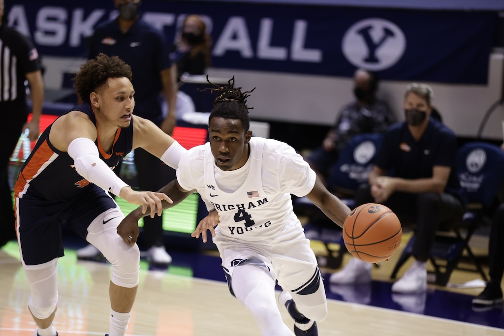 BYU guard Brandon Averette moves past Pepperdine's Colbey Ross during Saturday night's game at the Marriott Center between the Cougars and the Waves.