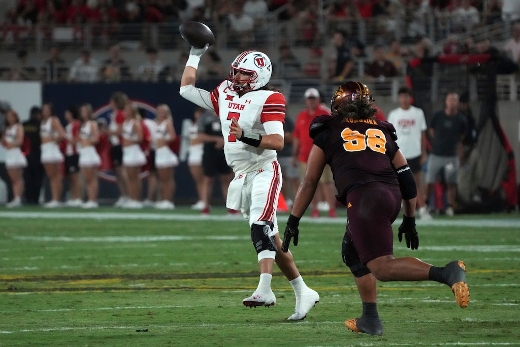 (Rick Scuteri | AP) Utah quarterback Cameron Rising throws in front of Arizona State defensive lineman Jacob Rich Kongaika (98) in the second half during an NCAA college football game, Friday, Oct. 11, 2024, in Tempe, Ariz.