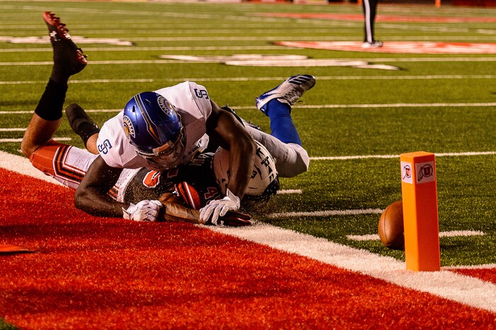 (Trent Nelson | The Salt Lake Tribune) Utah Utes wide receiver Raelon Singleton (11) loses his footing and the ball as San Jose State Spartans linebacker William Ossai (11) closes in as the Utah Utes host the San Jose State Spartans, NCAA football at Rice-Eccles Stadium in Salt Lake City, Saturday September 16, 2017.