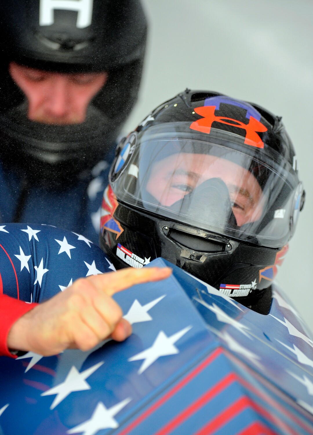 Driver Steven Holcomb, front, and brakeman Carlo Valdes, of the United States, react in the finish area after second run of the mens two-man bobsled World Cup race  with a combined score of 1:29:47 on Friday, Dec. 16, 2016, in Lake Placid, N.Y. (AP Photo/Hans Pennink)

