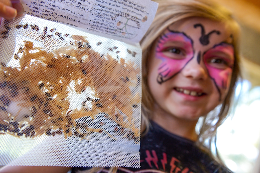 Leah Hogsten  |  The Salt Lake Tribune  Tinlee Grice, 7, holds a bag of nearly three dozen ladybugs she was given for free to populate her yard during Earth Day celebration at the Ogden Nature Center, Saturday, April 20, 2019. 