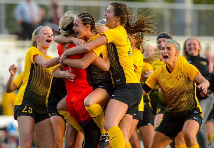 (Steve Griffin | The Salt Lake Tribune) Maple Mountain players charge the field as they defeat East in a shootout during 5A semifinal girl's soccer match at Juan Diego High School in Draper Tuesday October 17, 2017.