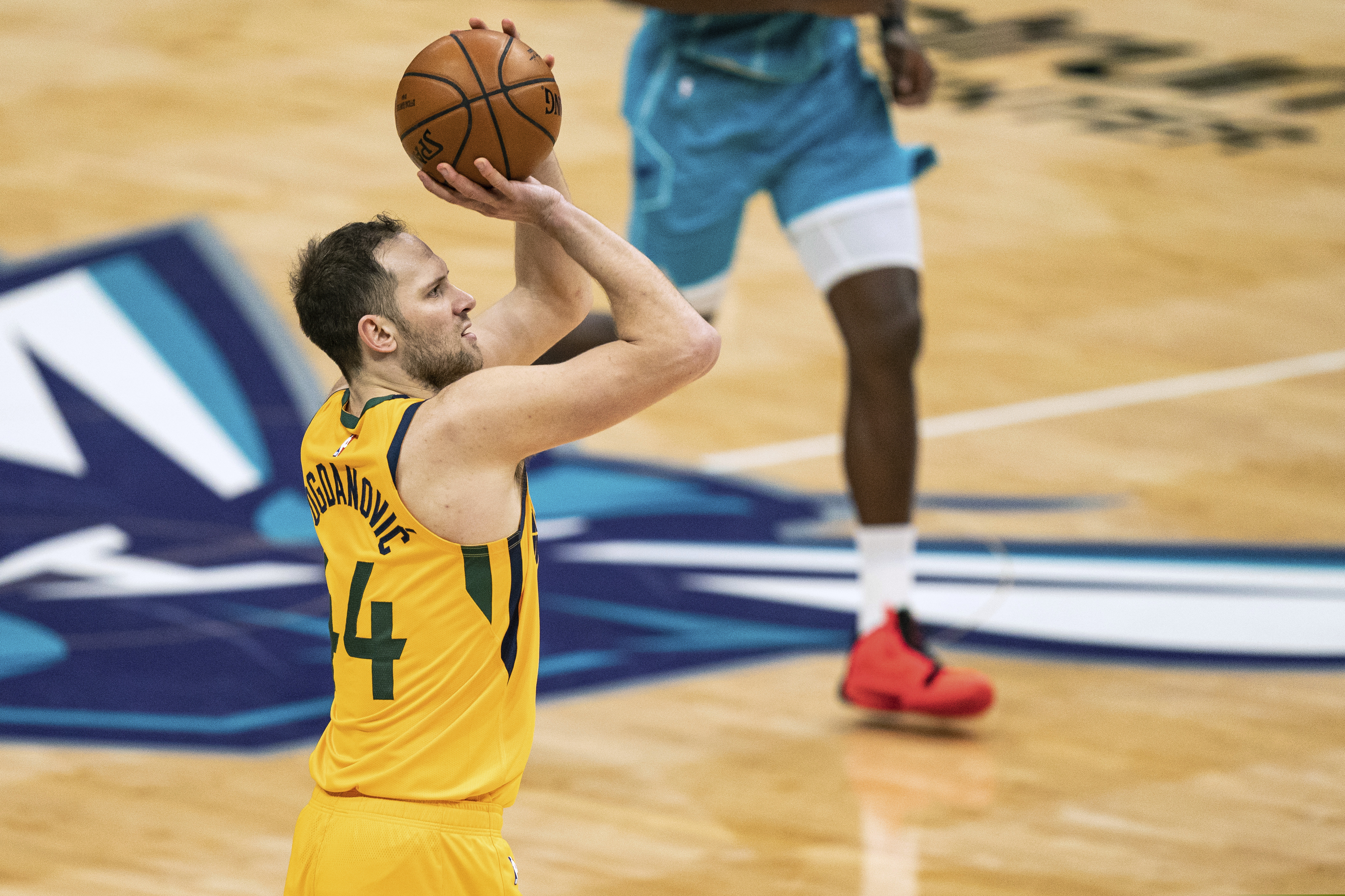 Utah Jazz forward Bojan Bogdanovic (44) shoots against the Charlotte Hornets during the second half of an NBA basketball game in Charlotte, N.C., Friday, Feb. 5, 2021. (AP Photo/Jacob Kupferman)
