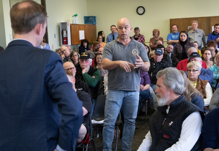 (Keith Johnson  |  for The Salt Lake Tribune) Newly elected Utah Congressman Ben McAdams, representing Utah's 4th District (left), listens to Stephen Olsen, a 20 year FBI agent and furloughed federal employee, during a town hall meeting held by McAdams at the Redwood Recreational Center in West Valley City, Utah on Jan. 19, 2019. McAdams held the town hall meeting to make good on a promise to be more accessible to constituents, a criticism he leveled against former congresswoman Mia Love during McAdam's campaign. 