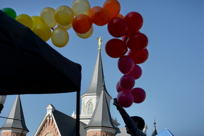 (Scott Sommerdorf   |  The Salt Lake Tribune)   
Volunteers set up the UVU LGBT student services booth across the street from the Provo LDS Temple, at the 5th annual Provo Pride Festival, Saturday, September 16, 2017.