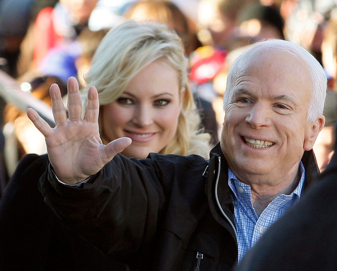 CORRECTS YEAR TO 2008  FILE - In this Oct. 30, 2008 file photo, Republican presidential candidate Sen. John McCain, R-Ariz., accompanied by his daughter Meghan McCain, waves to supporters as he enters a campaign rally in Defiance, Ohio.  Former Vice President Joe Biden sought to console the daughter of ailing Sen. John McCain after she began crying while discussing her father’s cancer on ABC’s “The View.” McCain is battling the same aggressive type of brain cancer that killed Biden’s son Beau in 2015.  (AP Photo/Stephan Savoia)