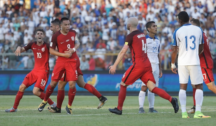 United States' Bobby Wood, 9, celebrates with teammates after scoring his team's first goal during a 2018 World Cup qualifying soccer match against Honduras in San Pedro Sula, Honduras, Tuesday, Sept. 5, 2017. (AP Photo/Rebecca Blackwell)
