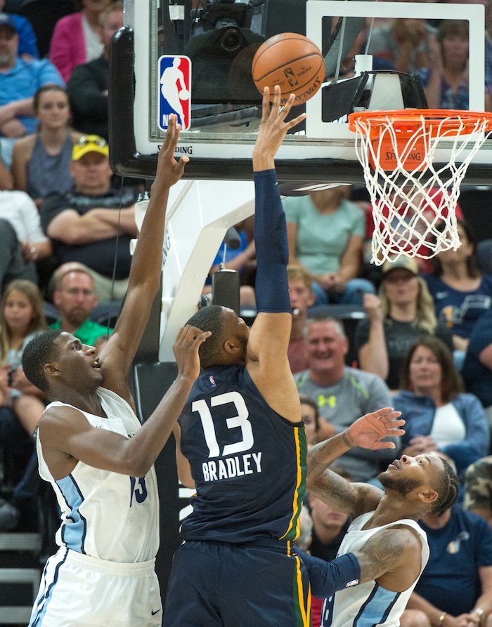 (Rick Egan  |  The Salt Lake Tribune)      Utah center Tony Bradley (13) scores for the Jazz, in Utah Jazz summer league action between Utah Jazz and Memphis Grizzlies in Salt Lake City, Tuesday, July 3, 2018.