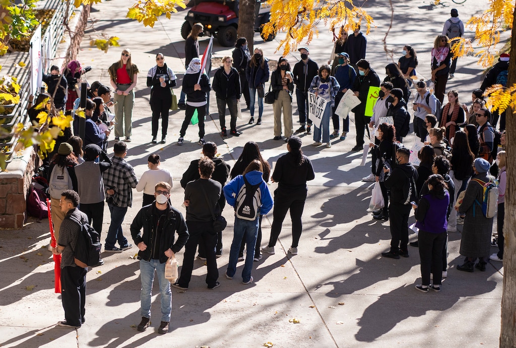 (Rick Egan | The Salt Lake Tribune)  Supporters of Mecha cheer listen to the speakers, during a protest on the University of Utah Campus, on Wednesday, Nov. 15, 2023.