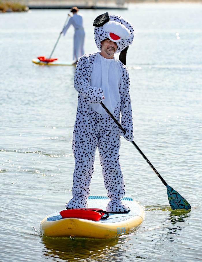 (Francisco Kjolseth  |  The Salt Lake Tribune) Chris Knoles shows off his Halloween spirit on the water as he paddle boards at Bountiful Pond on Oct. 31, 2020, in what has become a yearly tradition.