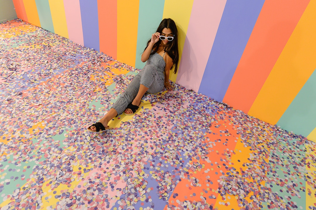 (Francisco Kjolseth  |  The Salt Lake Tribune)  Riley Gracie poses for a friend's camera in the cereal room at Hall of Breakfast, a quirky new art exhibit that celebrates the first meal of the day. The exhibit runs through July 9 at The Gateway.