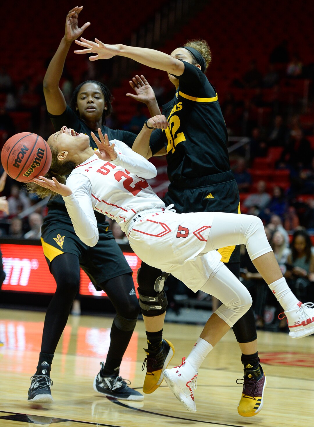 (Francisco Kjolseth  |  The Salt Lake Tribune) Utah Utes guard/forward Daneesha Provo (23) takes a hard hit that injures her knee while battling ASU in Utes' Pac-12 home opener at the Jon M Huntsman Center on Friday, Jan. 4, 2019. Off to one of their best starts in team history, their twelve in a row winning streak came to an end losing to the Sun Devils 63-65.