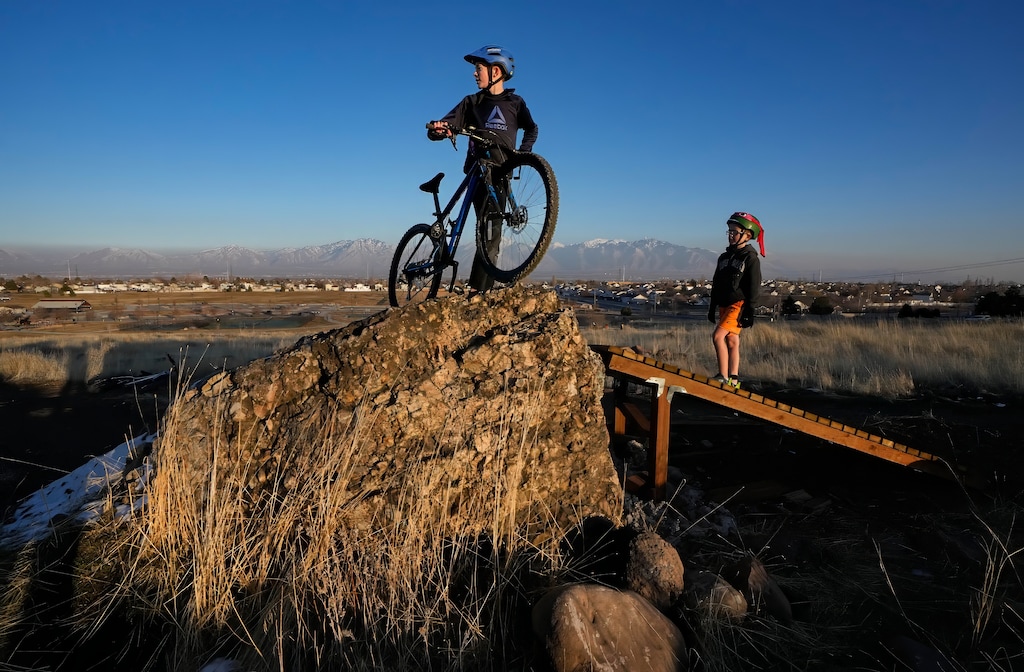 (Francisco Kjolseth | The Salt Lake Tribune) Brothers Sam Anderson, 13, and Jacob, 11, explore some of the more advanced cycling terrain at Lodestone Regional Park in West Valley City on Thursday, Jan. 30, 2025.
