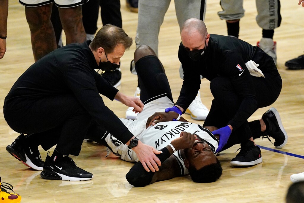Brooklyn Nets forward Jeff Green is attended to after being injured in a collision with Los Angeles Clippers guard Patrick Beverley during the second half of an NBA basketball game Sunday, Feb. 21, 2021, in Los Angeles. (AP Photo/Mark J. Terrill)