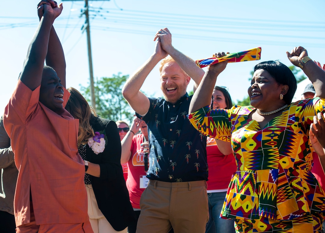 (Rick Egan | The Salt Lake Tribune) Jesse Tyler Ferguson celebrates with Ashraf and Anifah Barobi while filming an episode of the TV show "Extreme Makeover: Home Edition" in Ogden, Thursday, Aug. 15, 2019.