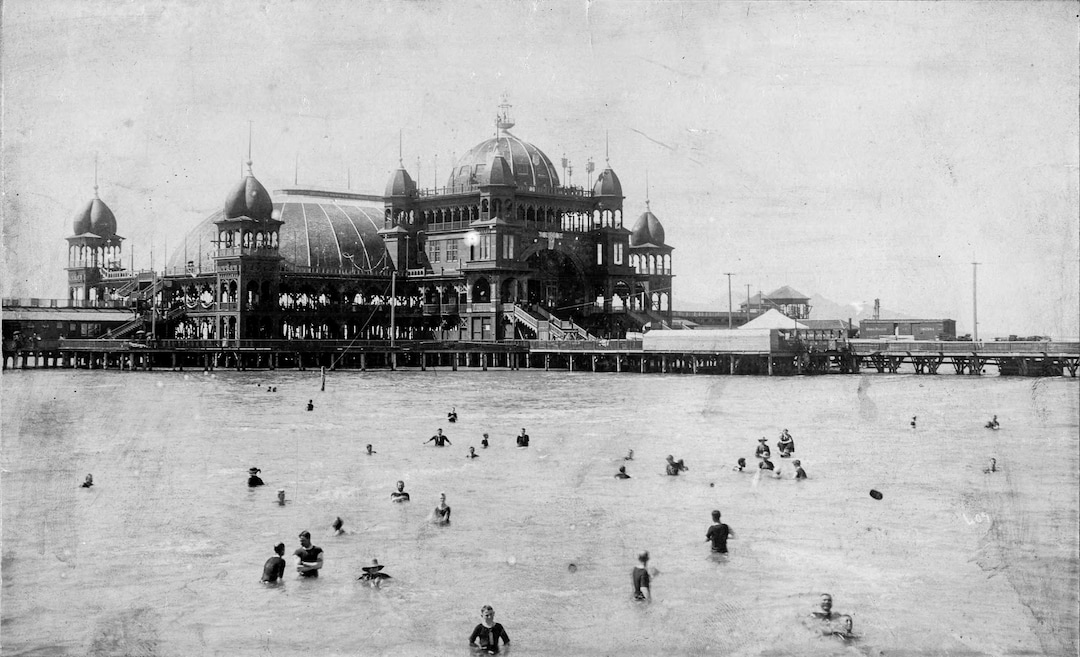 (Utah State Historical Society) Visitors to Saltair I float in the Great Salt Lake at the resort's front, indicating high water levels at the lake at that time.