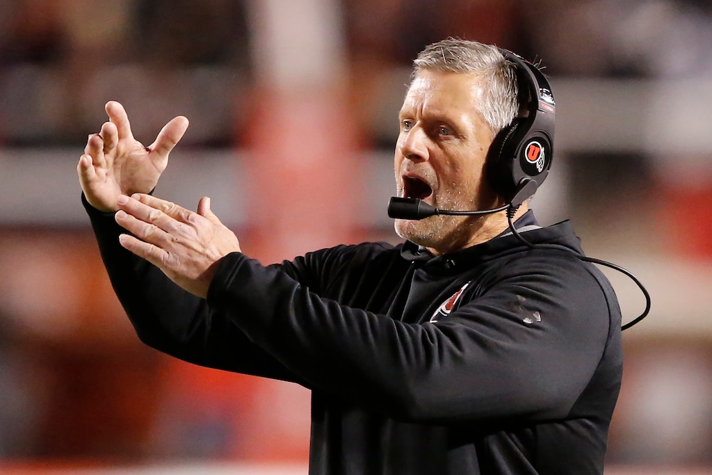 FILE—In this Oct. 26, 2019, file photo, Utah coach Kyle Whittingham calls for a timeout during the first half of the team's NCAA college football game against California in Salt Lake City. Utah plays Arizona this week. Utah typically has a robust home-field advantage. But there will be no fans inside Rice-Eccles Stadium, where there have been 64 straight sellouts. Utah is 70-24 at home under Whittingham, including 7-0 in 2019. (AP Photo/Rick Bowmer, File)