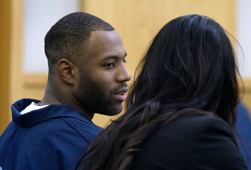 (Eli Lucero  |  Pool photo)  Torrey Green talks to his lawyer Skye Lazaro in 1st District Court on Thursday in Logan. Green will have his seven rape cases consolidated into two trials, which will be moved to Box Elder County.
