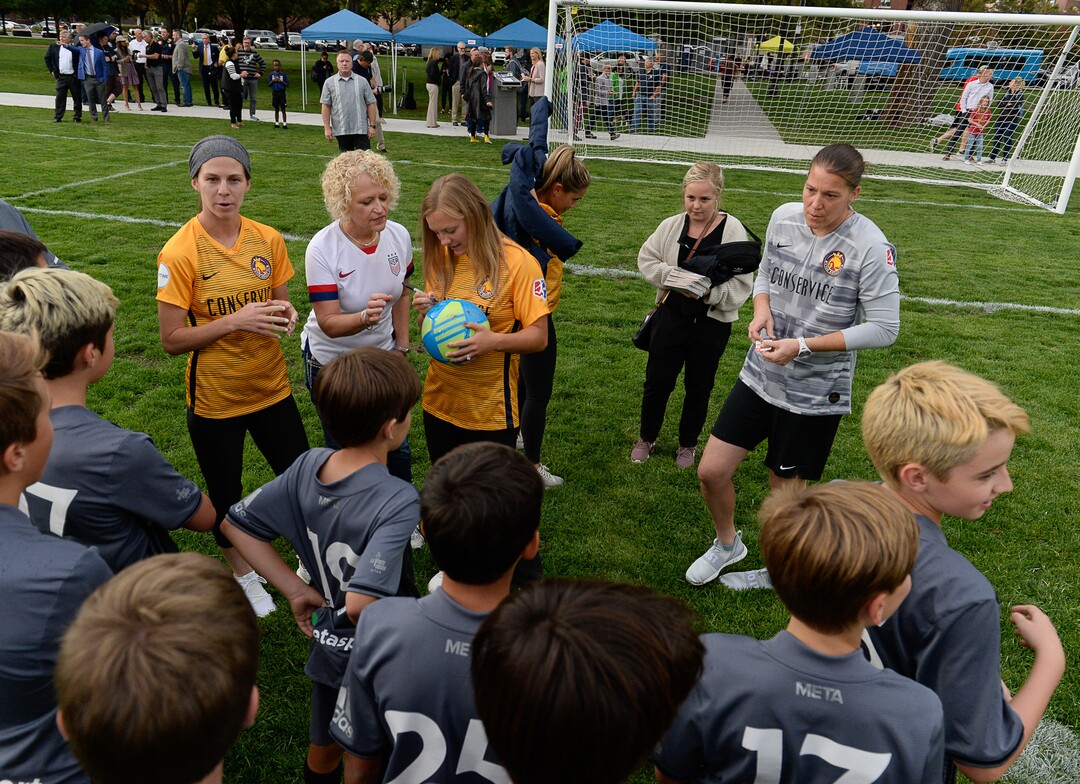 (Francisco Kjolseth  |  The Salt Lake Tribune)  Salt Lake City Mayor Jackie Biskupski gets her ball signed by Utah Royals FC players as they are joined by the Metasport FC youth soccer league during a jubilee in celebration of the recently completed improvements at Pioneer Park on Tuesday, September 10, 2019.