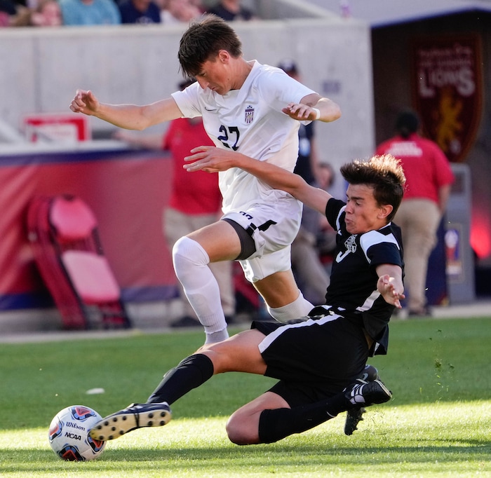 (Francisco Kjolseth | The Salt Lake Tribune) Herriman's Dax Neilson (27) battles Davis's Luke Bitner (3) during their 6A State Soccer Championship title game at Rio Tinto Stadium, Wednesday, May 25, 2022. Herriman defeated Davis 1-0 with two seconds left on the clock.