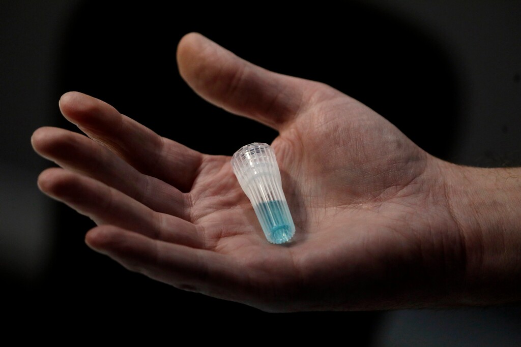 (Rick Bowmer | AP) In this April 3, 2020, photo, blue preservation solution is shown at Spectrum DNA in Draper. The company has developed a test kit to detect the coronavirus in patients' saliva. At least two Utah companies have developed tests and gotten emergency authorization from the U.S. Food and Drug Administration: molecular diagnostics company Co-Diagnostics and ancestry-testing kit maker Spectrum DNA.