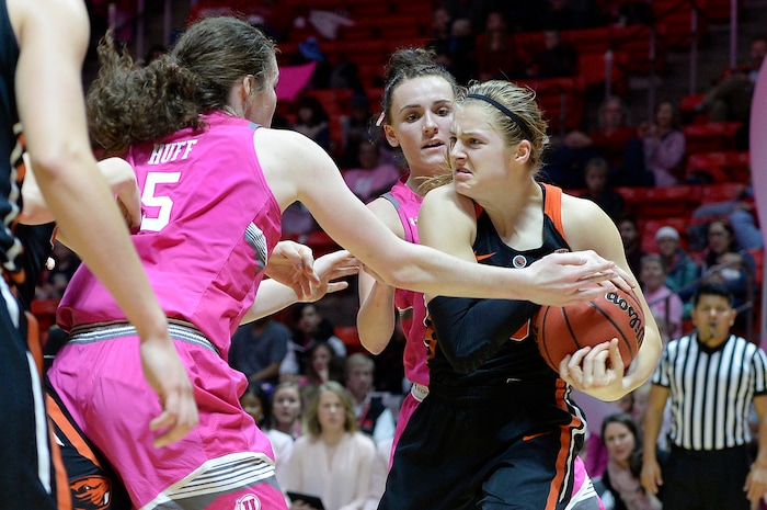 Scott Sommerdorf | The Salt Lake TribuneOregon State Beavers guard Mikayla Pivec (0) grimaces as she tries to rip a loose ball away from Utah Utes center Megan Huff (5) during second half play. Oregon State defeated Utah 69-58, Friday, January 26, 2018.