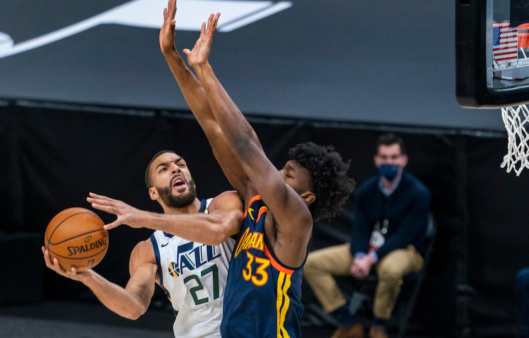 (Rick Egan | The Salt Lake Tribune) Utah Jazz center Rudy Gobert (27) collides with Golden State Warriors center James Wiseman (33) as he goes up for a shot, in NBA action between the Utah Jazz and the Golden State Warriors at Vivint Arena, on  Saturday, Jan. 23, 2021.