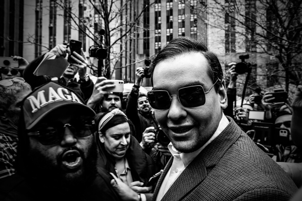 George Santos stands outside a New York City courthouse in support of then-former President Donald Trump on April 4, 2023. (Mark Peterson/The New York Times)