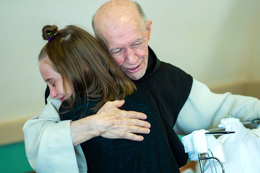 (Chris Detrick  |  The Salt Lake Tribune)  "Father Patrick" Boyle hugs Erin Vore, 12, of Farr West, in the bookstore and gift shop at the Abbey of Our Lady of the Holy Trinity in Huntsville on Wednesday, Aug. 23, 2017.