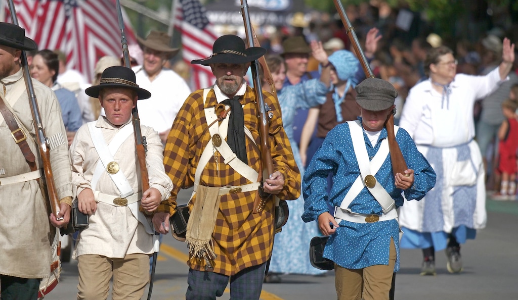 People celebrate the state's Mormon heritage during the Pioneer Day parade Tuesday, July 24, 2018, in Salt Lake City, as people in Utah gather to celebrate the state's history and recognize Mormon pioneers who trekked West in search of religious freedom. Pioneer Day is a beloved only-in-Utah holiday every July 24 that features parades, rodeos, fireworks and more. (AP Photo/Rick Bowmer)