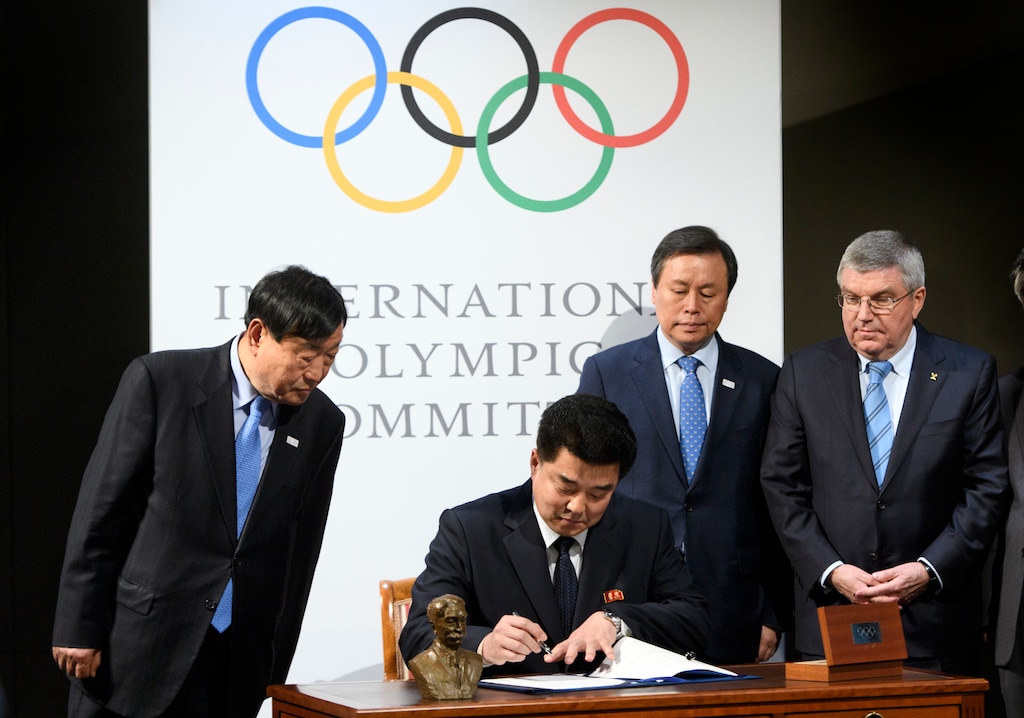 From left, Lee Hee-beom, president of the PyeongChang Organizing Committee for the 2018 Olympic and Paralympic Winter Games, North Korea's Olympic Committee President and sports minister Kim Il Guk, South Korea's Sports Minister Do Jong-hwan and International Olympic Committee, IOC, President Thomas Bach, from Germany are pictured during a signing ceremony during the North and South Korean Olympic Participation Meeting at the Olympic Museum of the IOC in Lausanne, Switzerland, Saturday, Jan. 20, 2018. (Laurent Gillieron/Keystone via AP)
