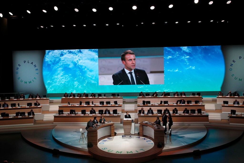 French President Emmanuel Macron delivers a speech at the One Planet Summit, in Boulogne-Billancourt near Paris, France, Tuesday, Dec. 12, 2017. More than 50 world leaders are gathering in Paris for a summit that President Emmanuel Macron hopes gives new momentum to the fight against global warming despite U.S. President Donald Trump's rejection of the Paris climate accord. (AP Photo/Christophe Ena)