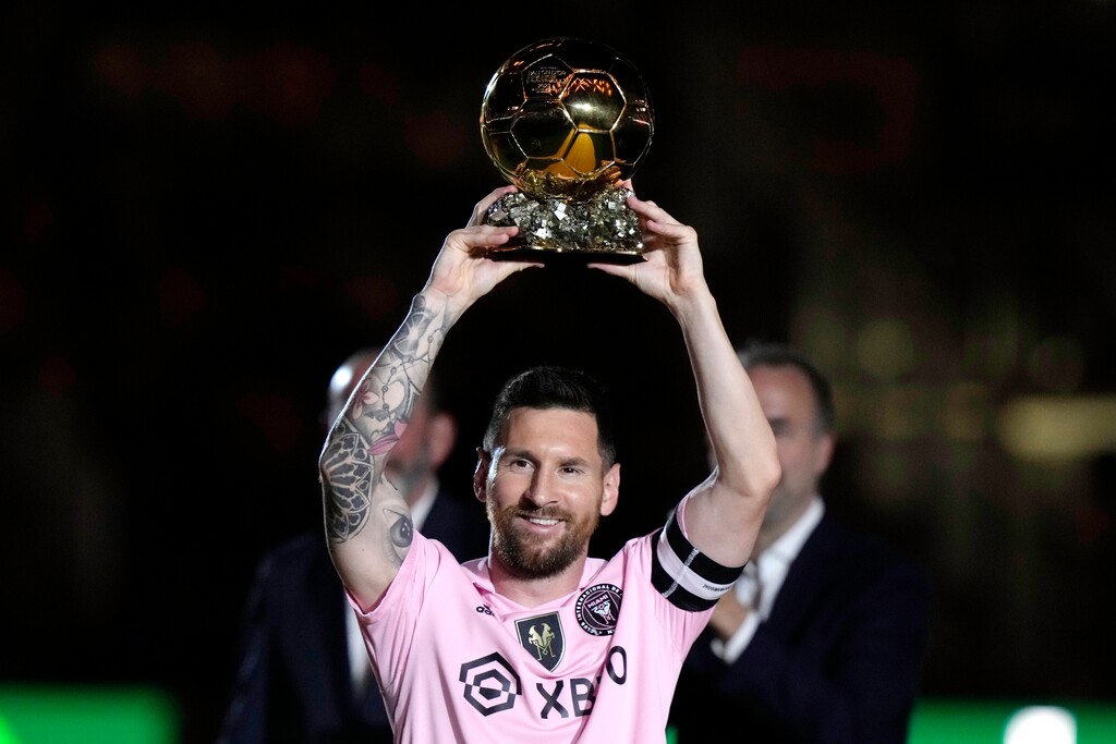 Inter Miami forward Lionel Messi holds his Ballon d'Or trophy before the team's club friendly soccer match against New York City FC, Friday, Nov. 10, 2023, in Fort Lauderdale, Fla. (AP Photo/Lynne Sladky)