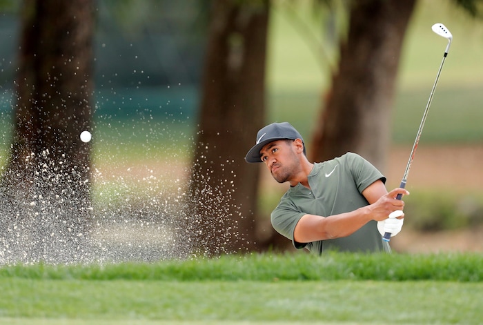 Tony Finau chips onto the 1st green during the final round of the Valspar Championship golf tournament, Sunday, March 12, 2017, at Innisbrook in Palm Harbor, Fla. (AP Photo/Mike Carlson)