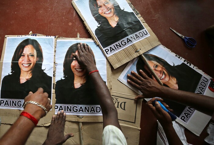 FILE - In this Nov. 6, 2020, file photo, villagers prepare placards featuring U.S. democratic vice presidential candidate Sen. Kamala Harris, as they prepare to celebrate should the Democratic Party win the presidential elections, in Painganadu a neighboring village of Thulasendrapuram, south of Chennai, Tamil Nadu state, India. Harris made history Saturday, Nov. 7,  as the first Black woman elected as vice president of the United States, shattering barriers that have kept men — almost all of them white — entrenched at the highest levels of American politics for more than two centuries. (AP Photo/Aijaz Rahi, File)