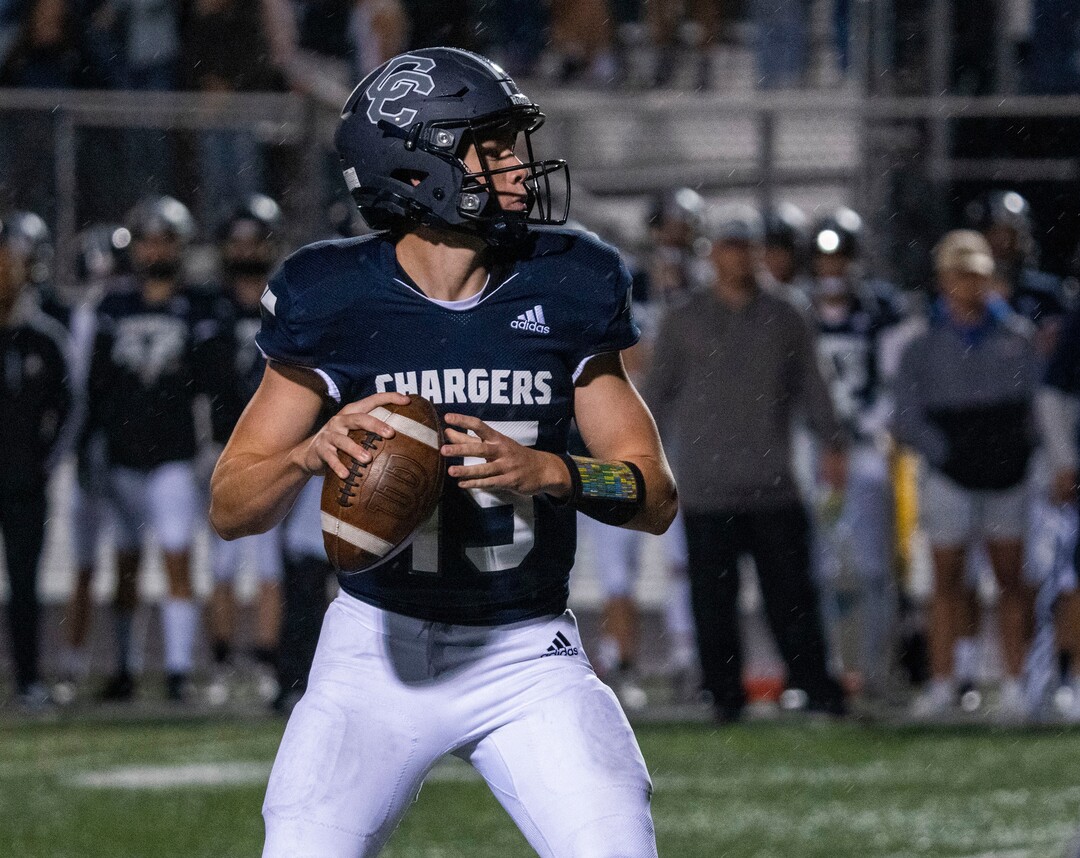 (Rick Egan | The Salt Lake Tribune) Corner Canyon quarterback Devin Brown (15), looks for an open man, in prep football action between Corner Canyon Chargers and the East Leopards, on Saturday, Aug. 21, 2021.